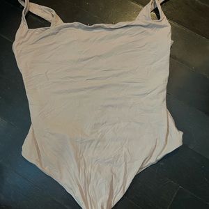 Brownish pink skims low back thong body suit in size L